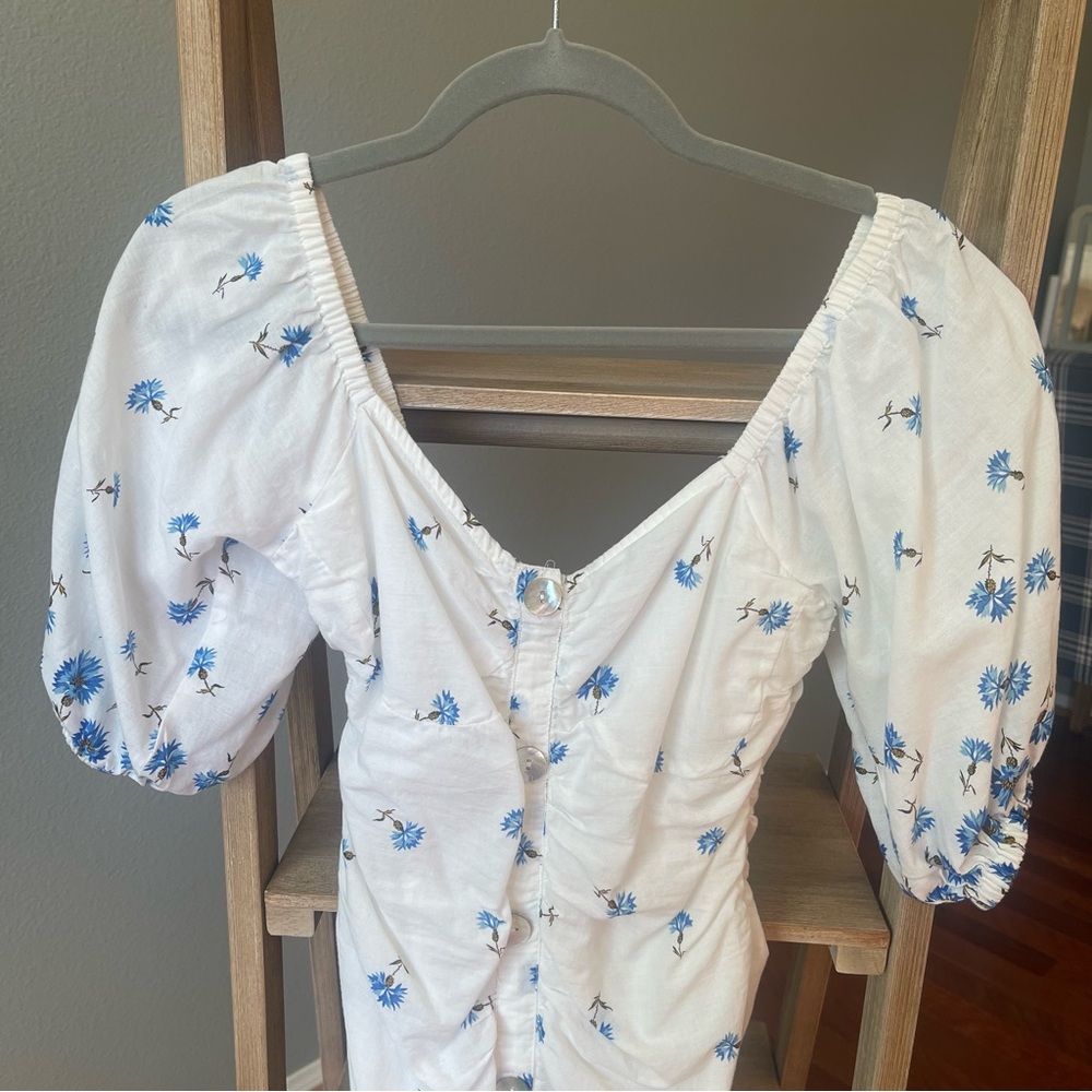 Elegant White Midi Dress with Blue Floral Design